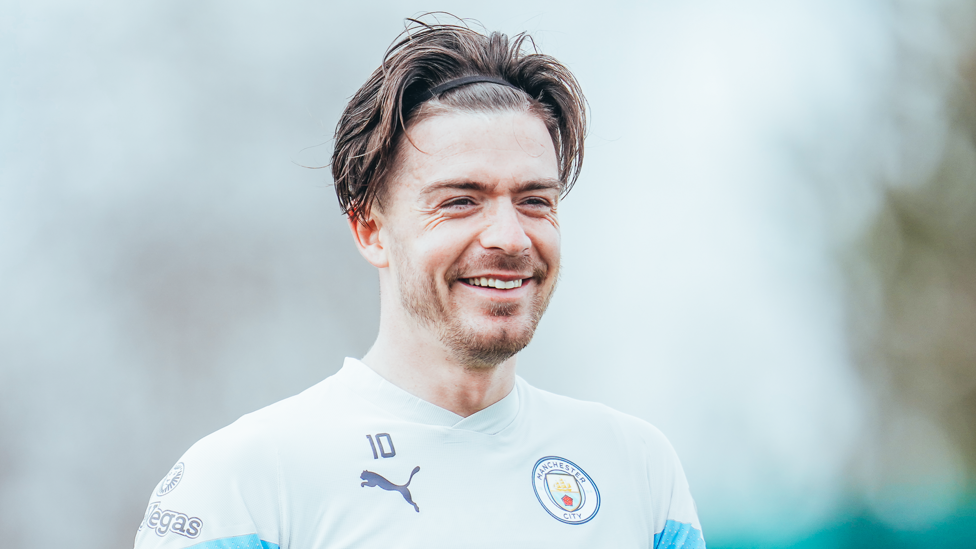 JOYOUS JACK : Grealish shares a joke