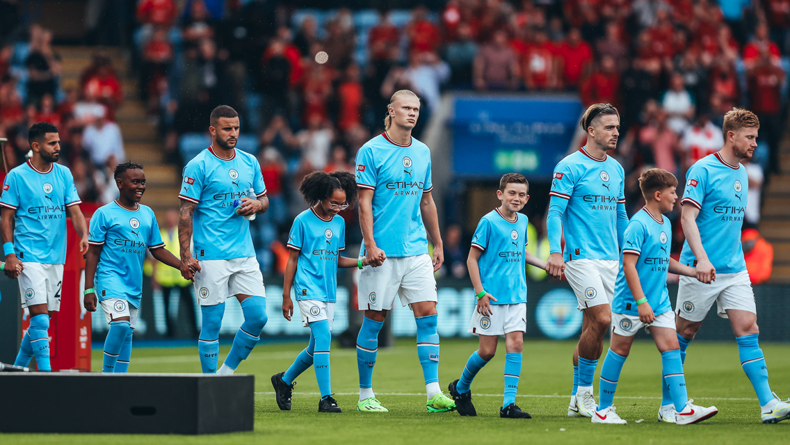 SQUAD GOALS: City's starters make their way onto the pitch.