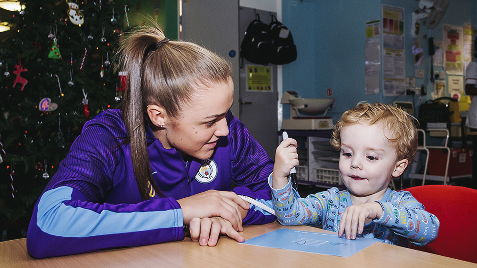 CHEERS GAFFER : Georgia Stanway receives some tactical advice