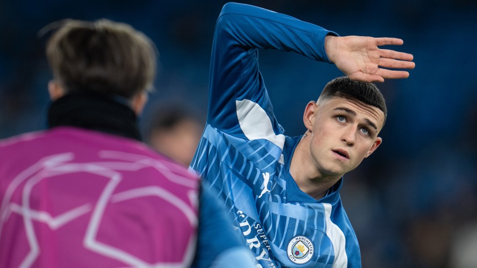 GET LOOSE : Foden goes through his pre-match stretches.