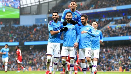 GUNDO-GOAL: The players mob Gundogan after his opener from the penalty spot.