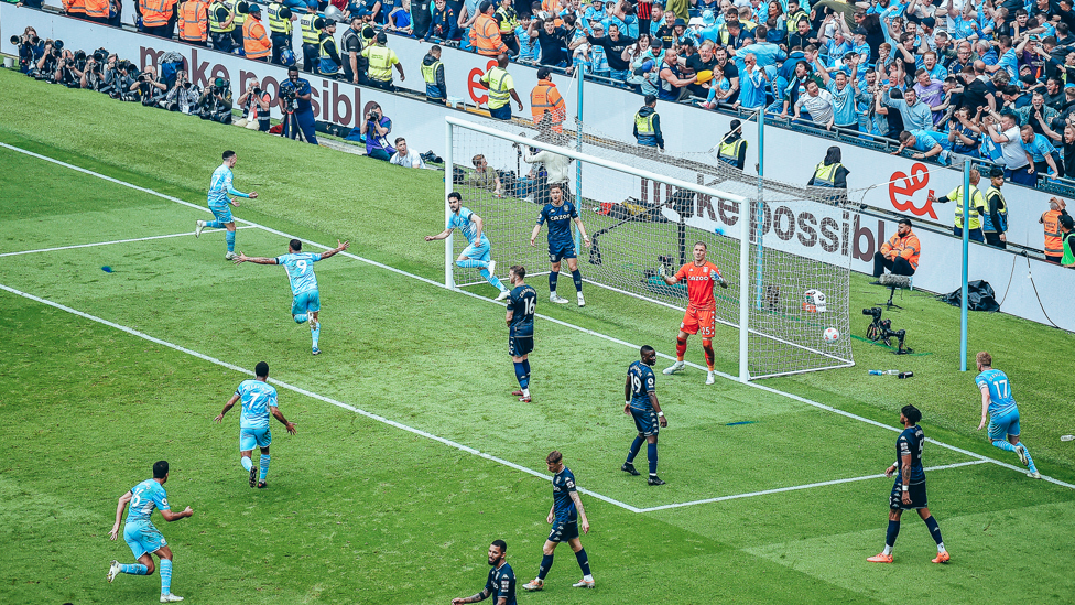 WINNING MOMENT : Ilkay Gundogan scores City's third against Aston Villa to leave us just minutes from the title on 22 May