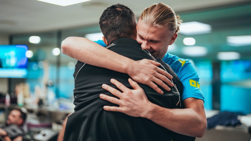 HAALAND HUG : Erling is delighted to see him back