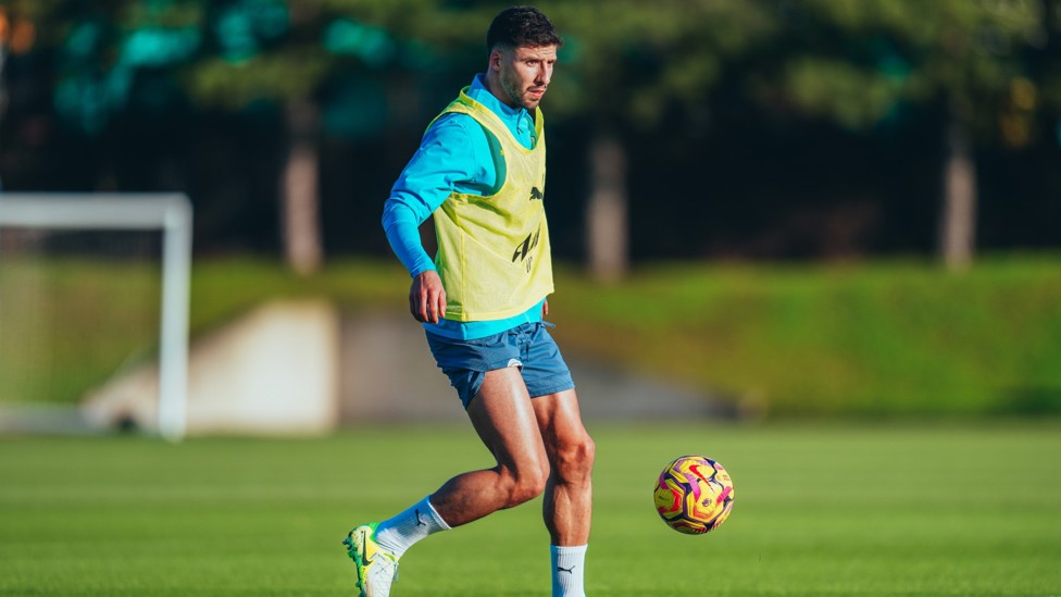 DEFENSIVE DUTIES : Ruben Dias brings the ball out