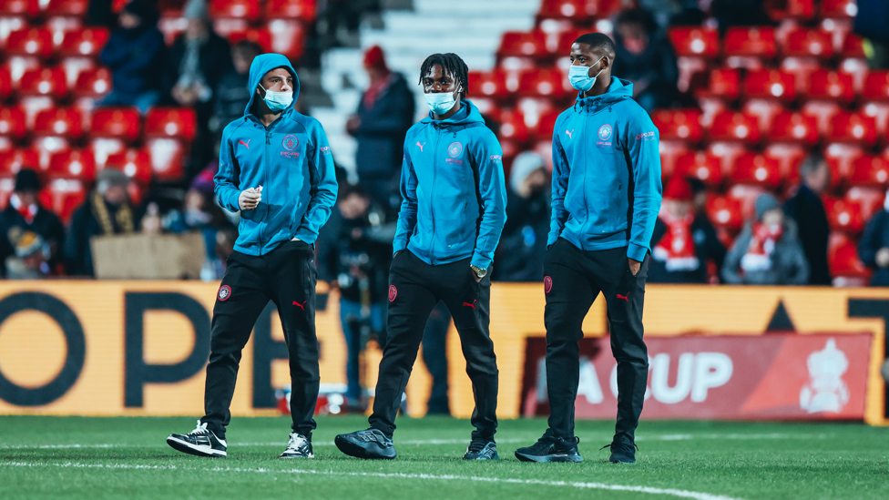 YOUNG GUNS : McAtee and co check out the pitch as they arrive at the stadium.