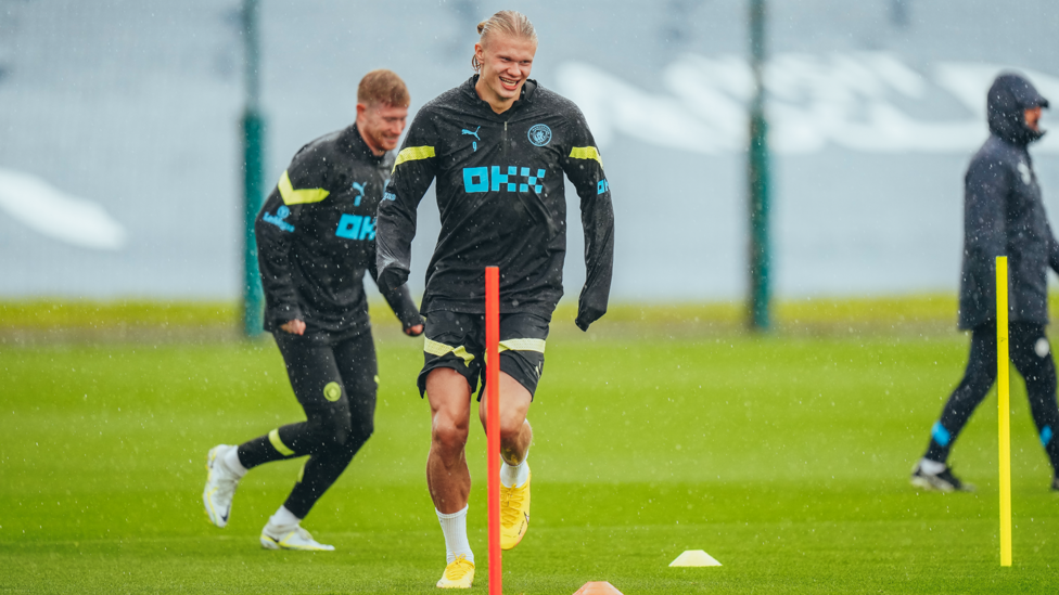 ACTION MAN: Erling Haaland is happy in his work despite the deluge!