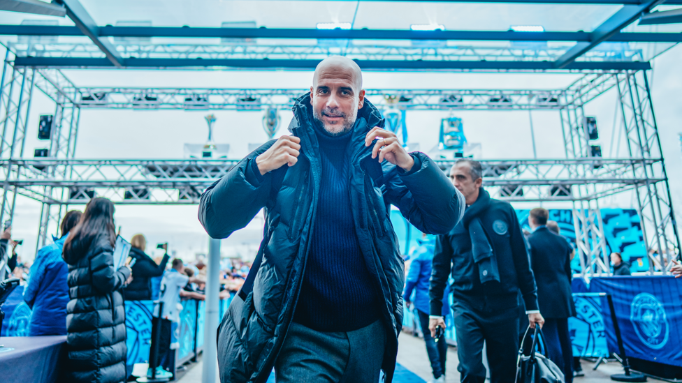 PEP ARRIVES: Pep Guardiola leads his players off the coach