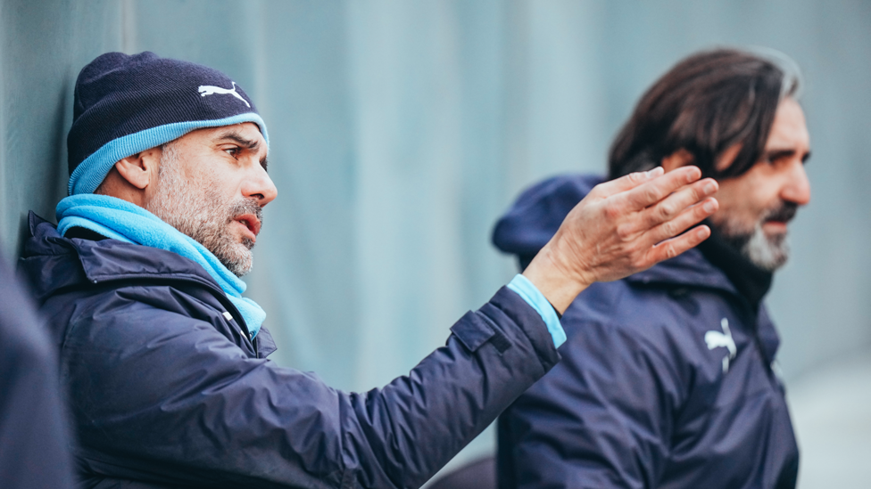 BOSSING IT : Pep Guardiola watches on with fitness coach Lorenzo Buenaventura