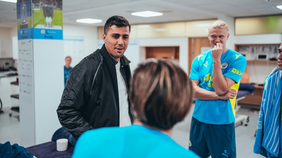 CATCHING UP : Rodri chats to his team-mates