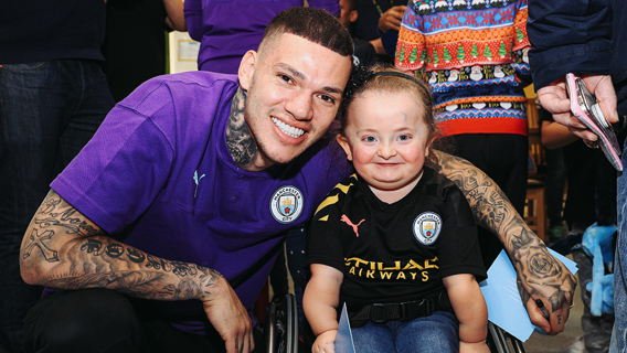 ALL SMILES: Ederson shares a special moment with one brave young patient