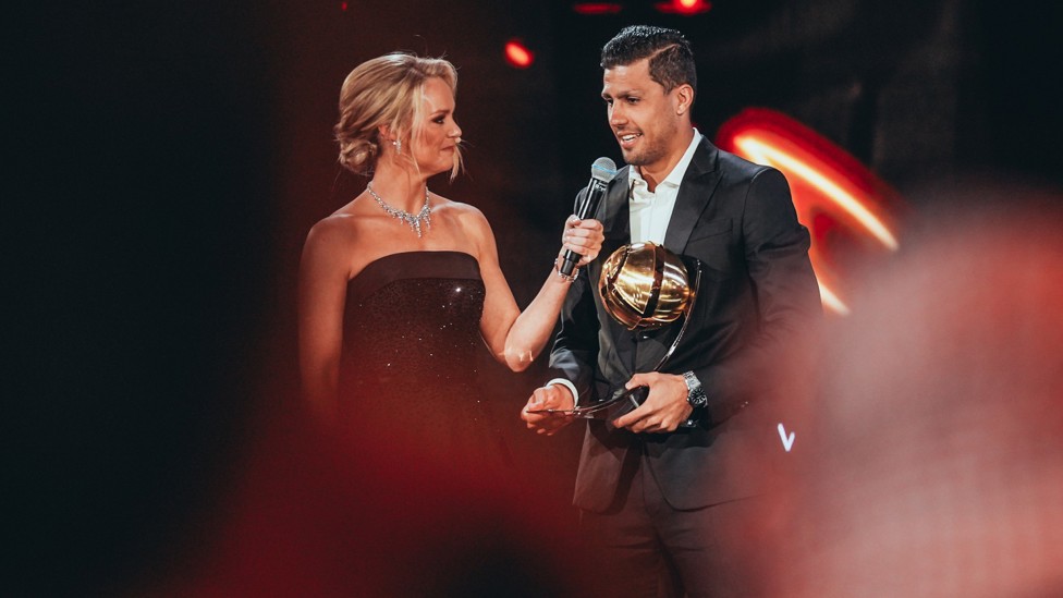 MIDDLE MAN : City’s classy central star, Rodrigo, is all-smiles after being presented with the Best Midfielder honour.