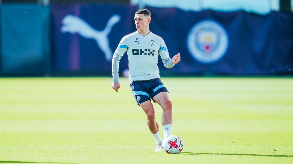 ACTION MAN: Phil Foden weighs up the options.