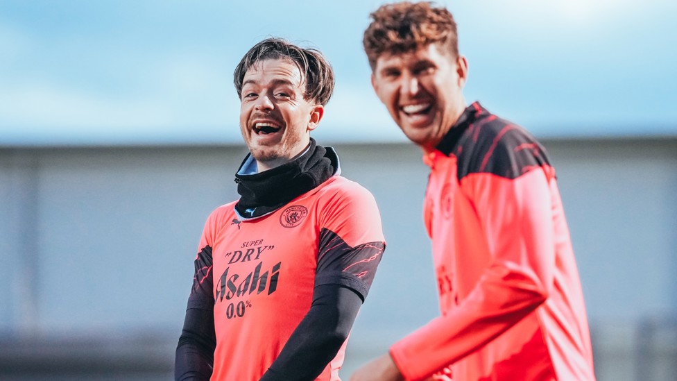 WHAT'S SO FUNNY? : Jack Grealish and John Stones clearly found something to be quite amusing!