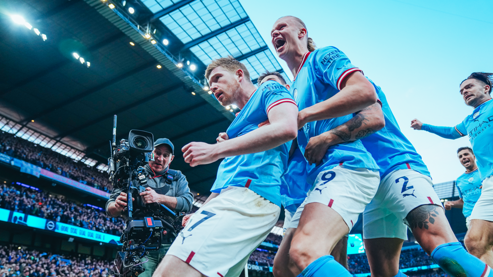 CRUCIAL  : City's players celebrate after De Bruyne gave us the lead in our vital 3-1 win over Arsenal.