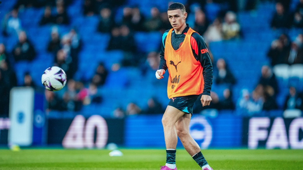 GETTING WARM : Phil Foden begins his pre-match routine. 