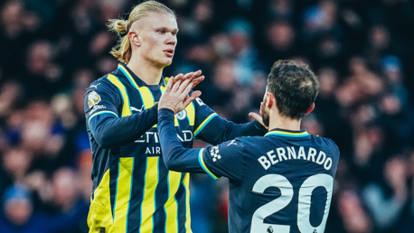 HIGH FIVE: Bernardo and Haaland celebrate.