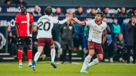 HIGH FIVES: Bernardo and Dias celebrate.