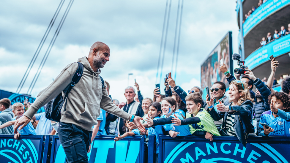 THE BOSS : Guardiola strides into the stadium.