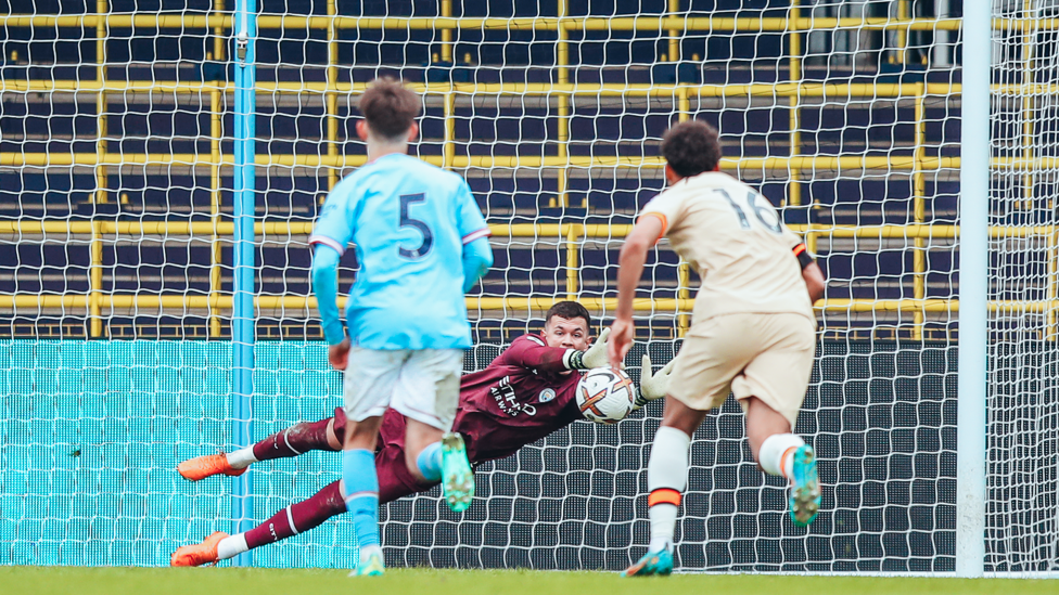 SAFE HANDS : Cieran Slicker saves a Chelsea penalty as City pick up another crucial three points