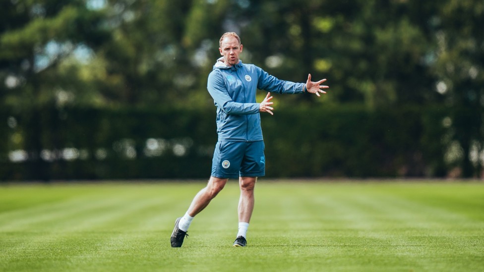 THE BOSS : Ben Wilkinson guides his players through the drill. 