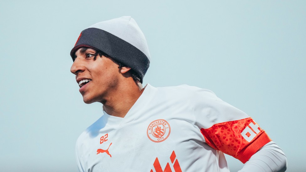 KEEPING WARM : Rico Lewis dons a bobble hat as he looks for a red-hot performance in training