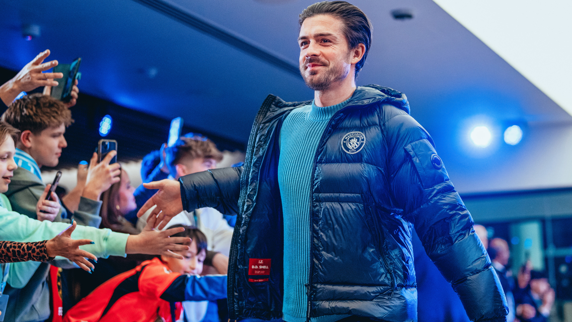 GRINNING GREALISH: In great mood when arriving at the stadium.