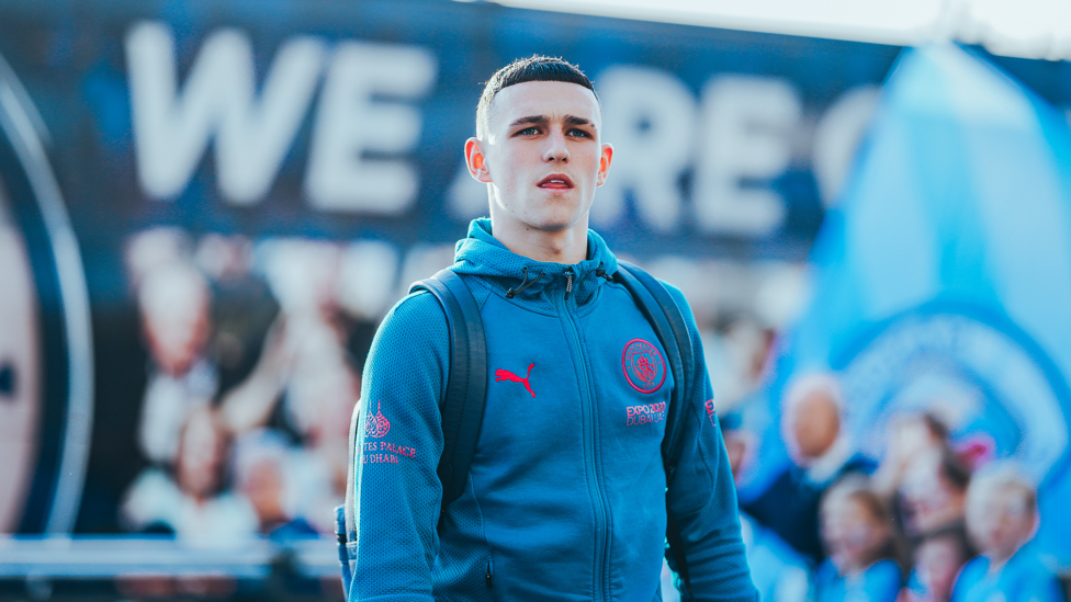 STEPPING INTO BATTLE GROUND : Phil Foden walks off the team bus with the squad