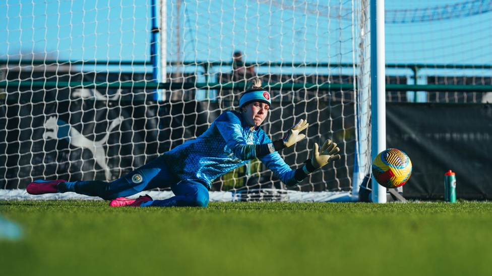 ACTION SHOT : Ellie Roebuck dives low to save a tricky shot.