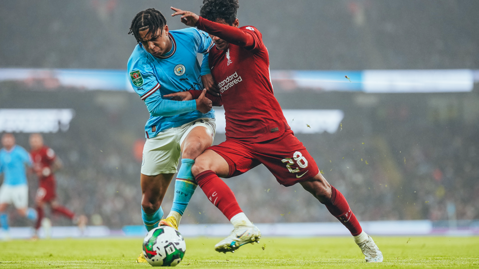 TUSSLE : Lewis battles with Carvalho shortly after the winger equalised for the visitors.