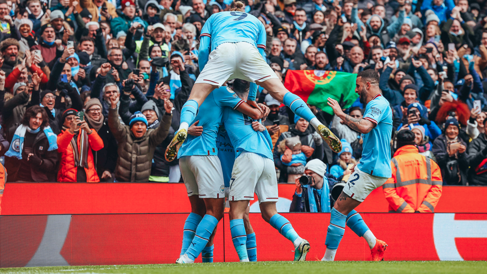 PILE ON: Erling Haaland gets involved with the celebrations with the crowd!