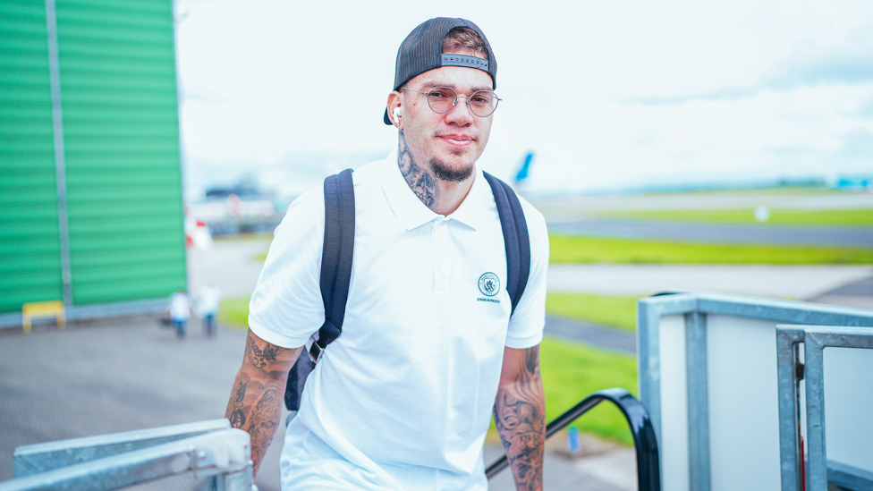 SOUTH AIRMERICAN : Ederson looks relaxed as he makes his way onto the plane. 