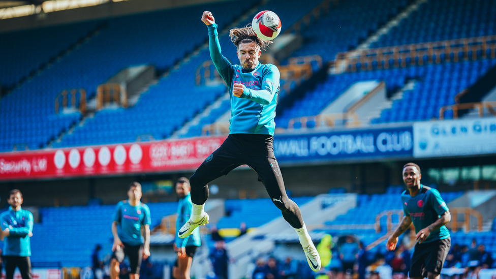 LEAP OF FAITH : Jack Grealish powers a header towards goal.