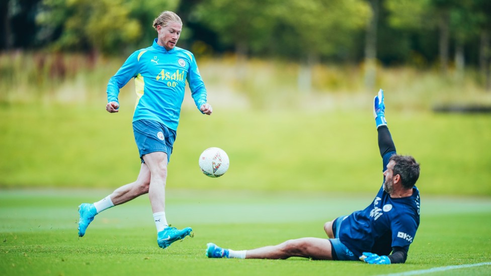 CHEEKY CHIP : De Bruyne lifts the ball over Scott Carson