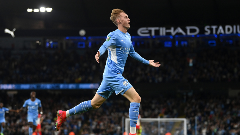 DRINK IT IN : Cole wheels away to take in the Etihad applause!