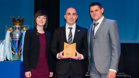 Manchester City Chief Operating Officer Omar Berrada receives the Club's Outstanding Contribution to Sport award from Councillor Emma Taylor and Neil Fairlamb