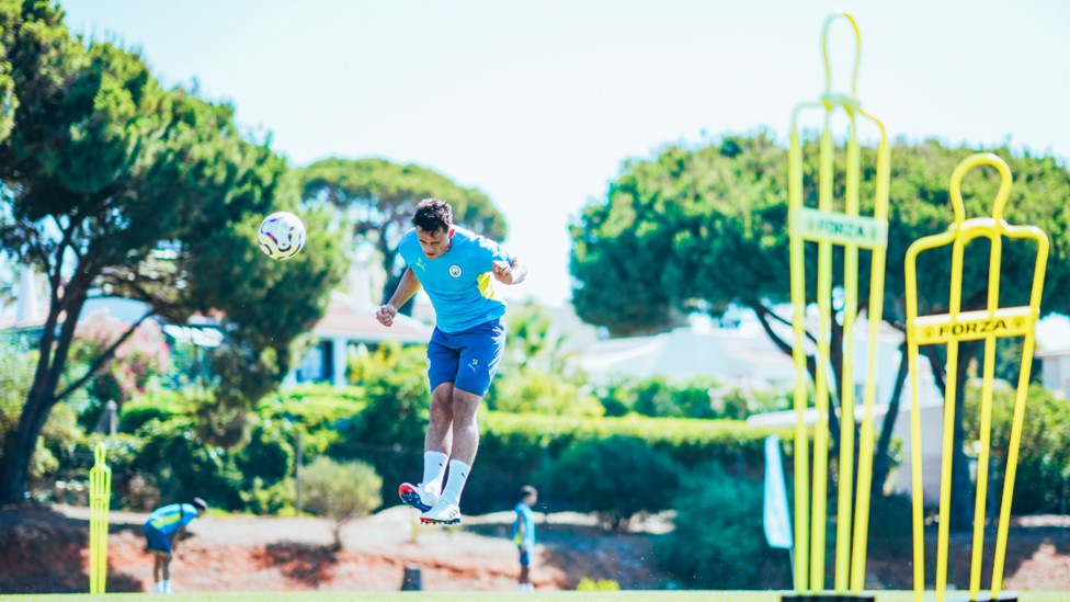 HEAD BOY: Isaac Smith powers in a header.