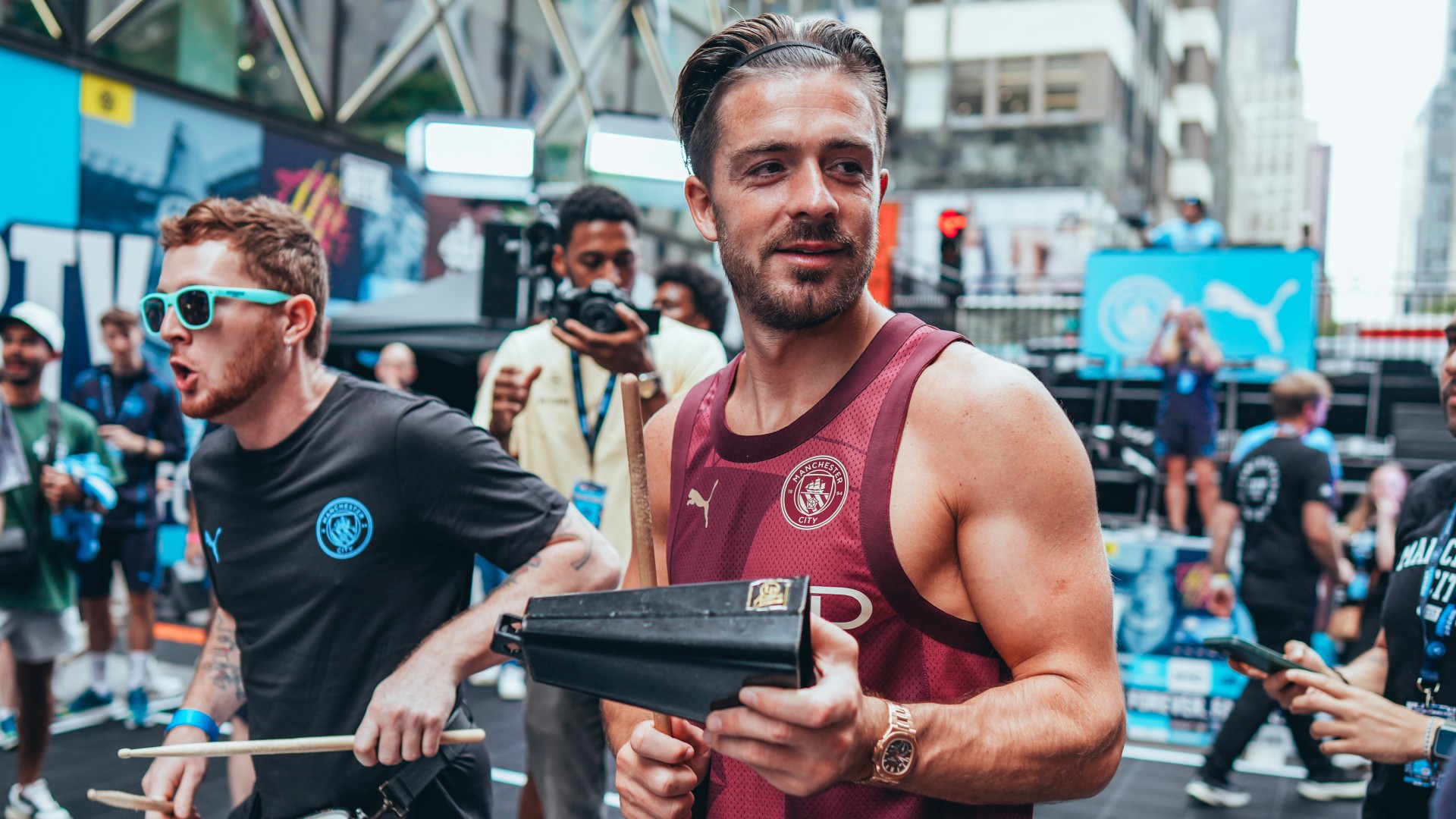 Man City star beam as he plays street basketball in New York in special outfit