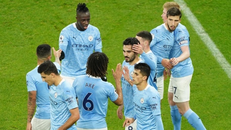 SHARE THE LOVE: The players gather to congratulate Gudogan after this opener.