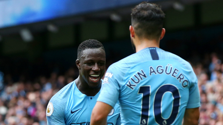 MERCI, MENDY!: Sergio Aguero thanks Benjamin Mendy for his assist, having completed his hat-trick with a glorious flick