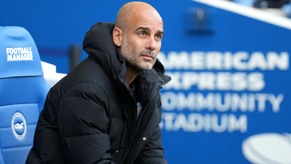 THE BOSS: Guardiola looks on from the dugout.