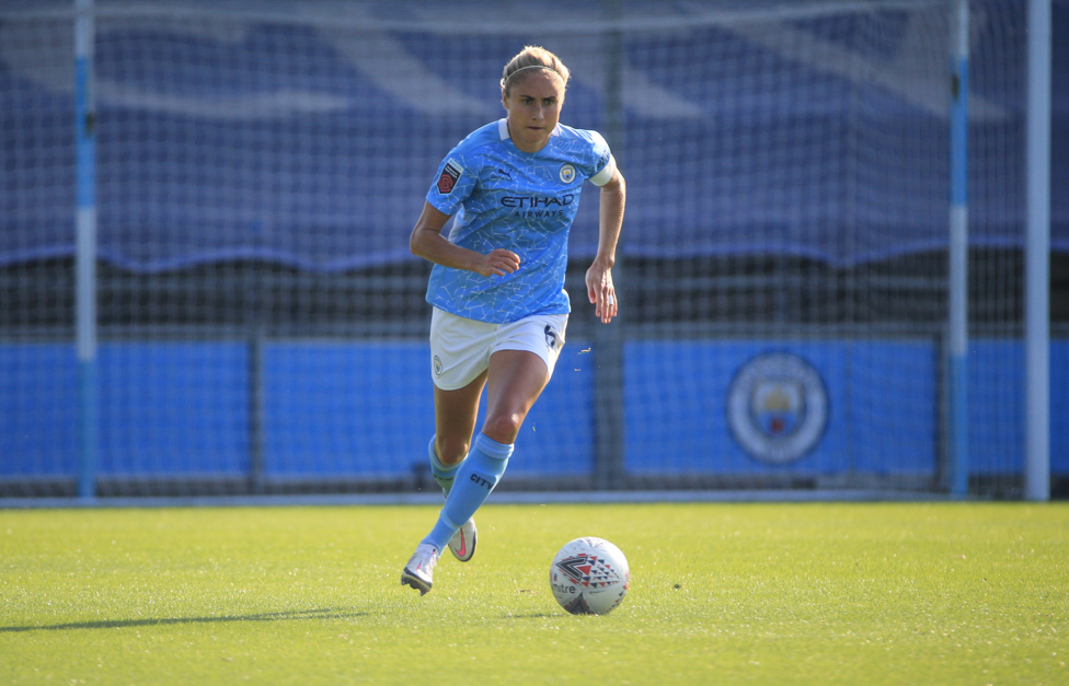 SKIPPER STEPH: : Steph Houghton carries the ball in a game against Brighton and Hove Albion in 2020.