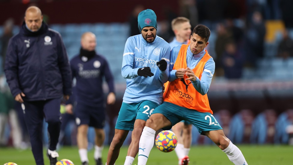 PLAY NICELY LADS : Riyad and Joao getting really stuck in during the warm up. 