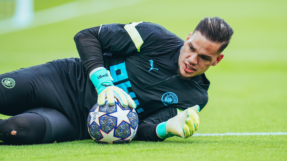 SAFE HANDS : Ederson gets a feel of the ball during the pre-match warm up.