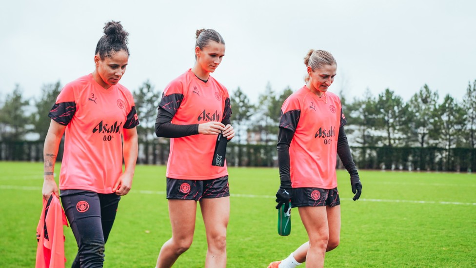 HARD YARDS : Demi Stokes, Kerstin Casparij and Laura Coombs make their way off the pitch