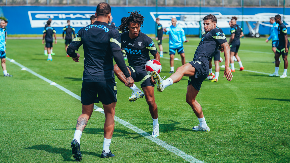 EYES ON THE PRIZE : Ake and Ruben Dias compete for a bouncing ball