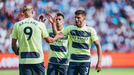 HIGH FIVE: Dias congratulates Haaland after his first City goal.