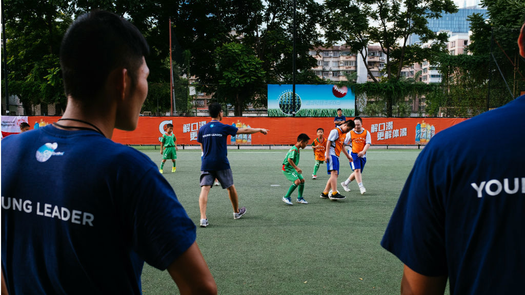 HELPING HAND : Young leaders hard at work in Guangzhou, China