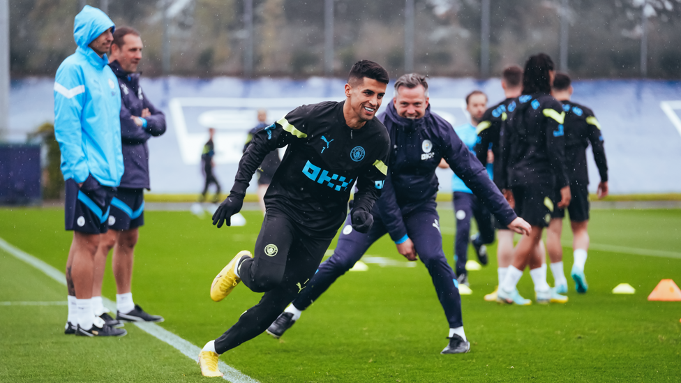 ALL SMILES : Joao Cancelo gets past his man. 