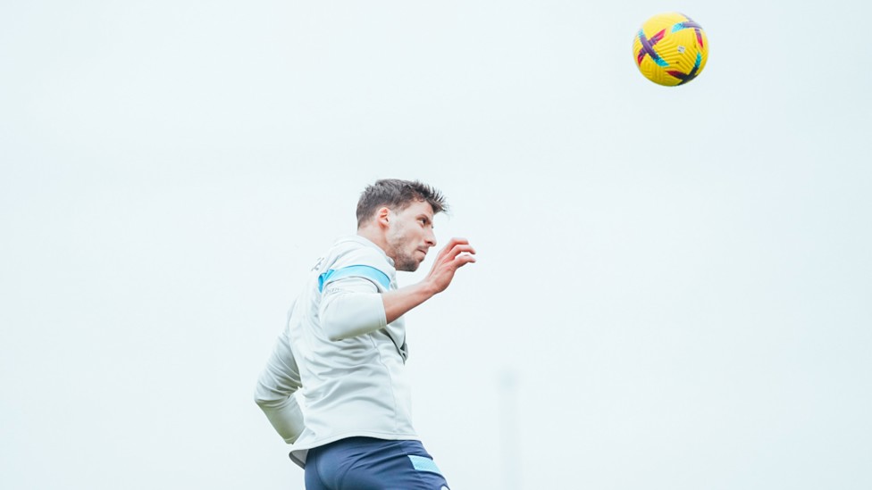 DOMINANT DIAS : Ruben Dias heads clear as he defends his goal in training.