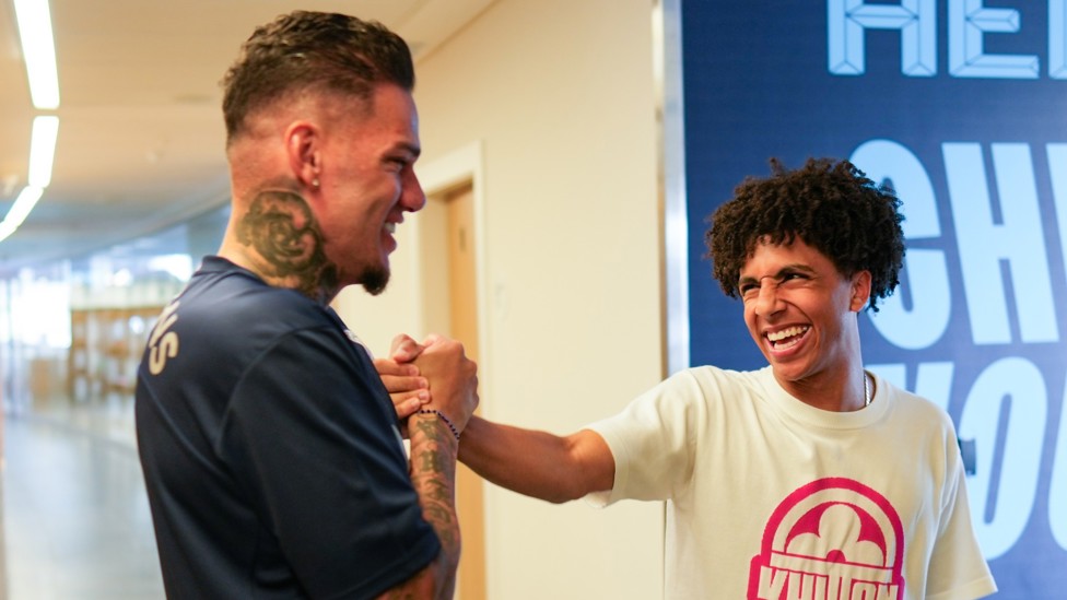 FOOTBALL FRIENDS : Ederson and Lewis greet each other.